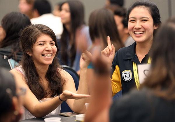 Students sitting around  table